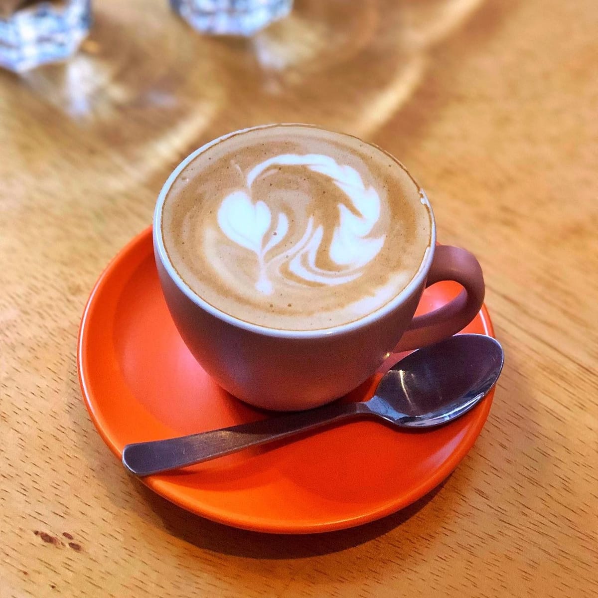 Enjoying a warm cup of latte on a cold snowy/rainy day, with a book in hand