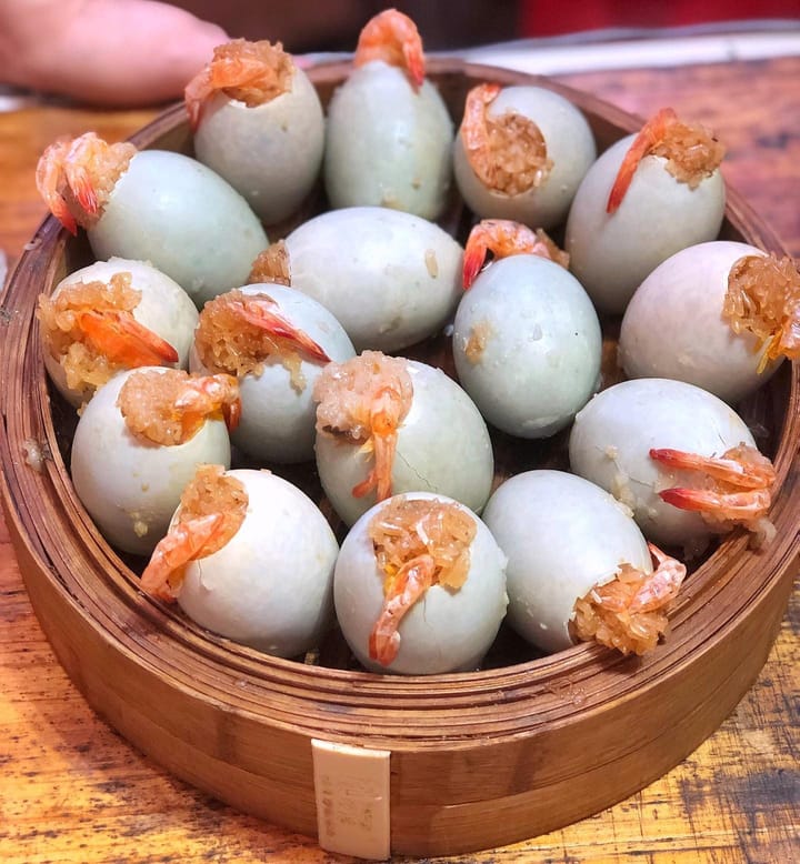 They stuff glutinous rice and a salted egg yolk into the empty egg